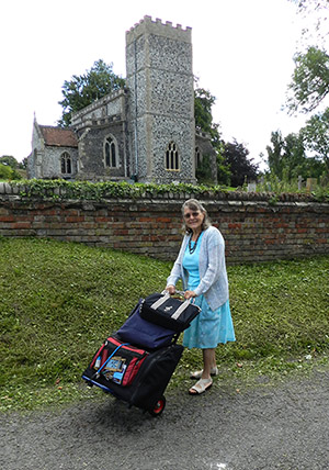 Gill with her accordion on her sack truck on her way to church