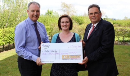ESE MD Simon Francis presents a cheque for £1000 to Nelson's Journey