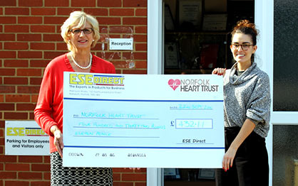 Melinda Raker from Norfolk Heart Trust receives the cheque