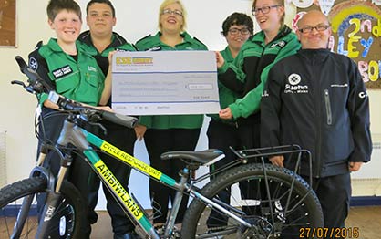 St John Ambulance Holyhead Cycle Responders with their ESE Direct cheque and responder bike