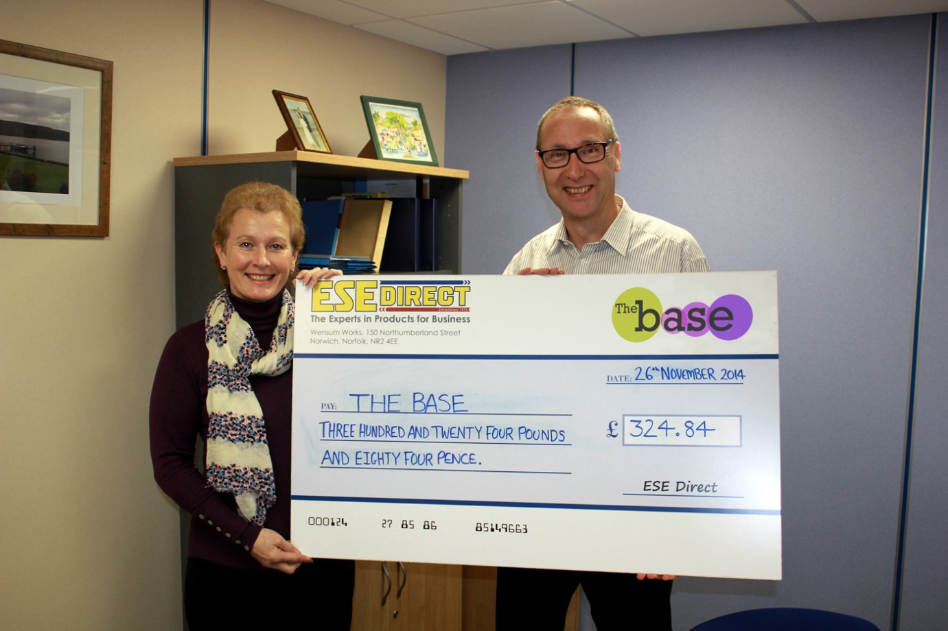 The Base Norwich receive their charity donation from ESE Direct's Mike Wyard