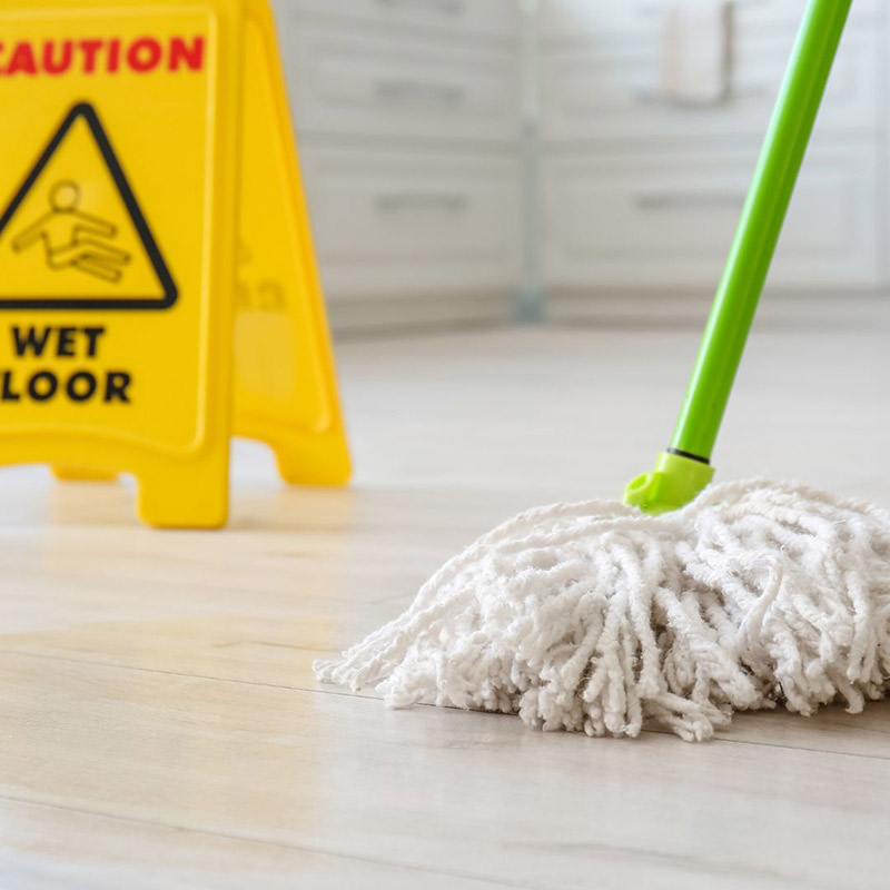 Caution wet floor sign with mop