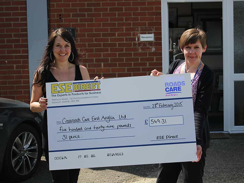 Debs presents the cheque to Lorraine Sartain who accepts the cheque on behalf of Crossroads Care East Anglia