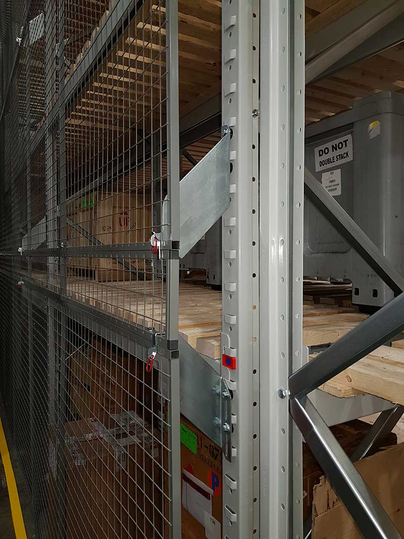 Brackets are used to attach anti-collapse mesh onto pallet racking