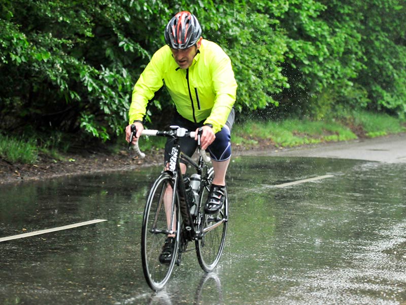 Paul Knights keeping his head down against the pouring rain along the 100 mile route