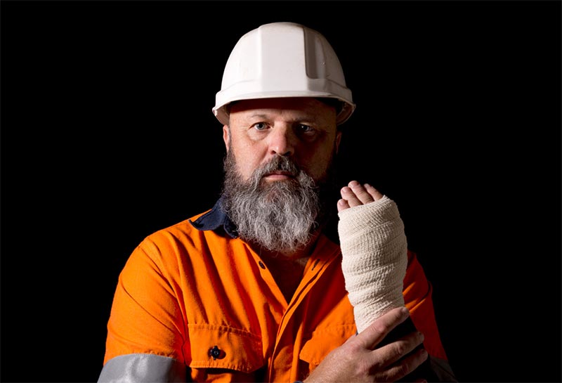 Workman with injured wrist