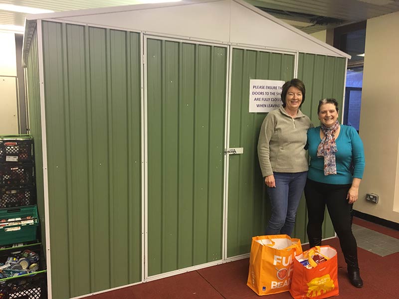 EK Community Food Bank volunteers, Lorna and Margaret McLeod with their galvanised storage shed