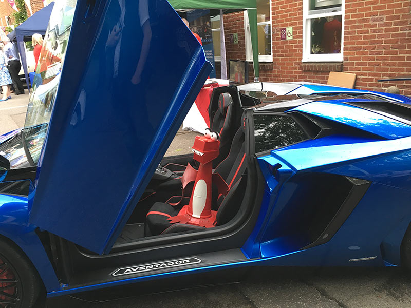 George enjoying sitting in a very fast car!