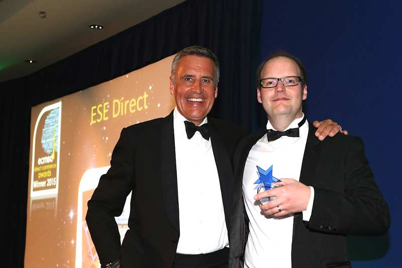 ESE Direct's Marketing Manager Martin Gilmour receives the award from Dermot Murnaghan