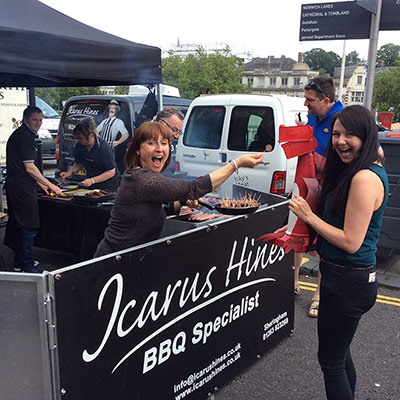 George samples a sausage from Icarus Hines Butchers