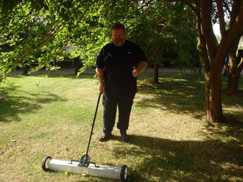 Kevin gives his magnetic sweeper the thumbs up