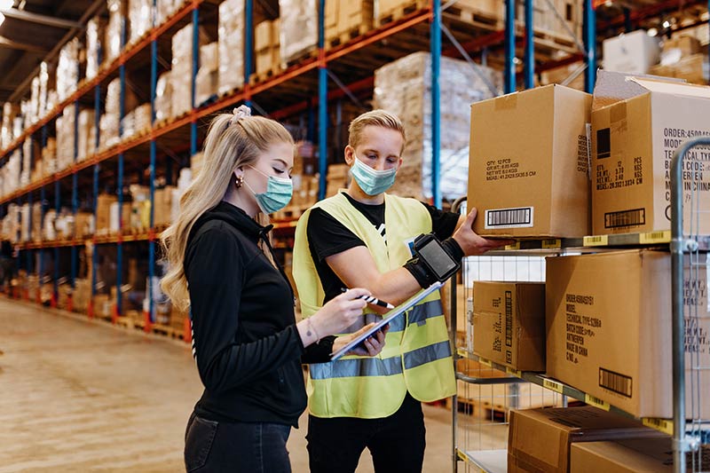 Warehouse workers using PPE